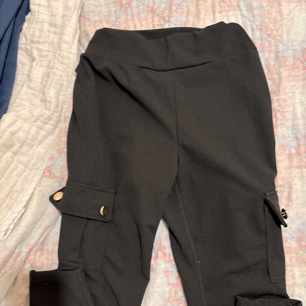Black leggings, high waisted with pockets. NWT no rips, no holes.